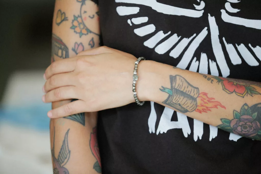 a woman with a tattoo on her arm