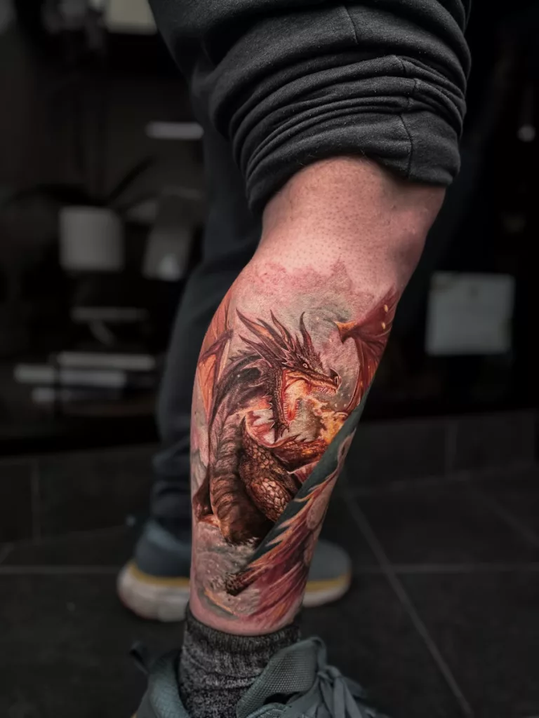 A man with a tattoo on his leg
